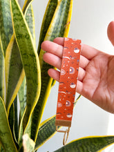Load image into Gallery viewer, Boho Rust Moons Keyfob Wristlets
